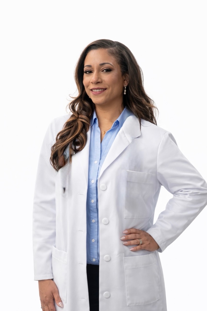 Dr. Choendal Zasaretti in a white physician coat